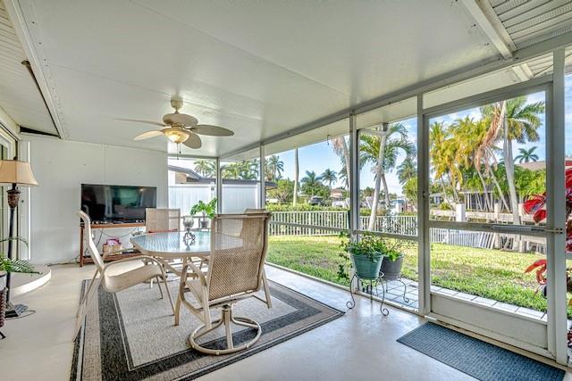 1131 Southeast 5th Avenue Pompano Beach, FL 33060 - Photo 28 of 39 a dining room with wooden floor and a floor to ceiling window