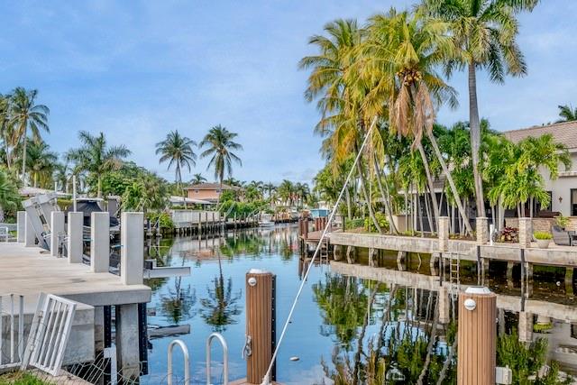 1131 Southeast 5th Avenue Pompano Beach, FL 33060 - Photo 33 of 39 a view of a lake with a palm tree