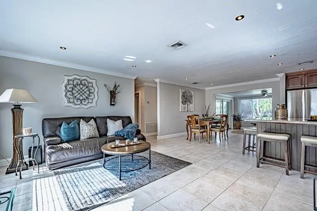 a living room with furniture and a table