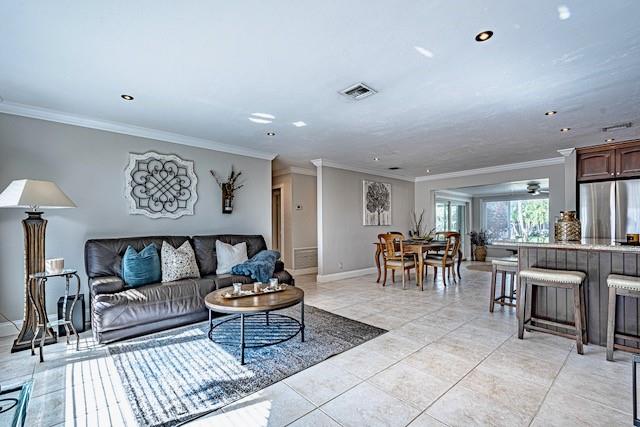 1131 Southeast 5th Avenue Pompano Beach, FL 33060 - Photo 4 of 39 a living room with furniture and a table