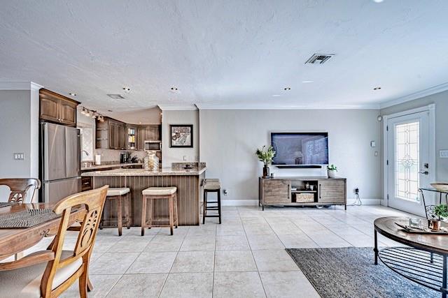 1131 Southeast 5th Avenue Pompano Beach, FL 33060 - Photo 5 of 39 a living room with furniture a rug kitchen view and a window