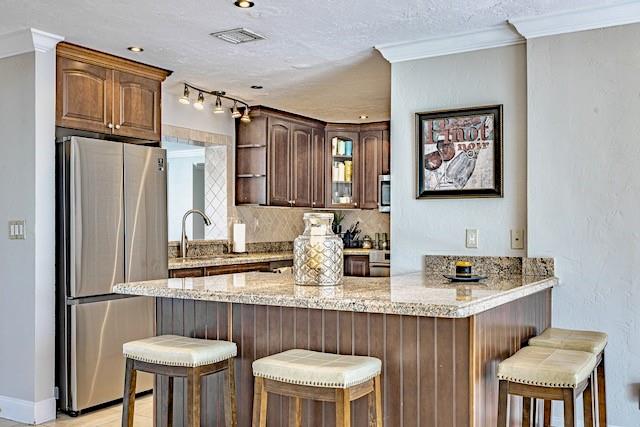 1131 Southeast 5th Avenue Pompano Beach, FL 33060 - Photo 7 of 39 a kitchen with stainless steel appliances a sink and a refrigerator