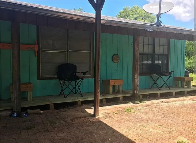 a backyard of a house with seating space