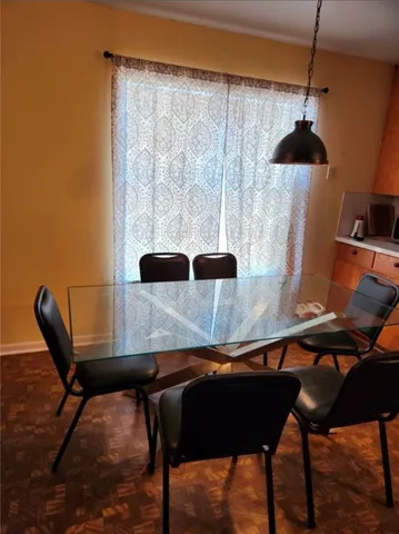 a kitchen with stainless steel appliances a sink a stove a refrigerator and cabinets