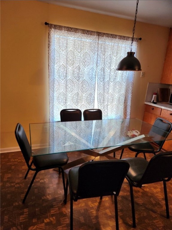 49 Bayview Drive Mathis, TX 78368 - Photo 11 of 20 a table and chairs in a room next to a window