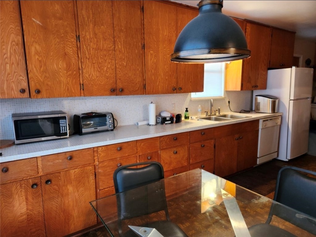 49 Bayview Drive Mathis, TX 78368 - Photo 12 of 20 a kitchen with stainless steel appliances a sink a stove a refrigerator and cabinets