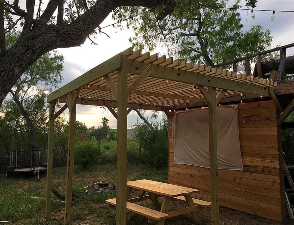 49 Bayview Drive Mathis, TX 78368 - Photo 20 of 20 a backyard of a house with table and chairs