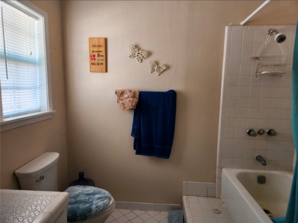 49 Bayview Drive Mathis, TX 78368 - Photo 6 of 20 a bathroom with a toilet and a shower