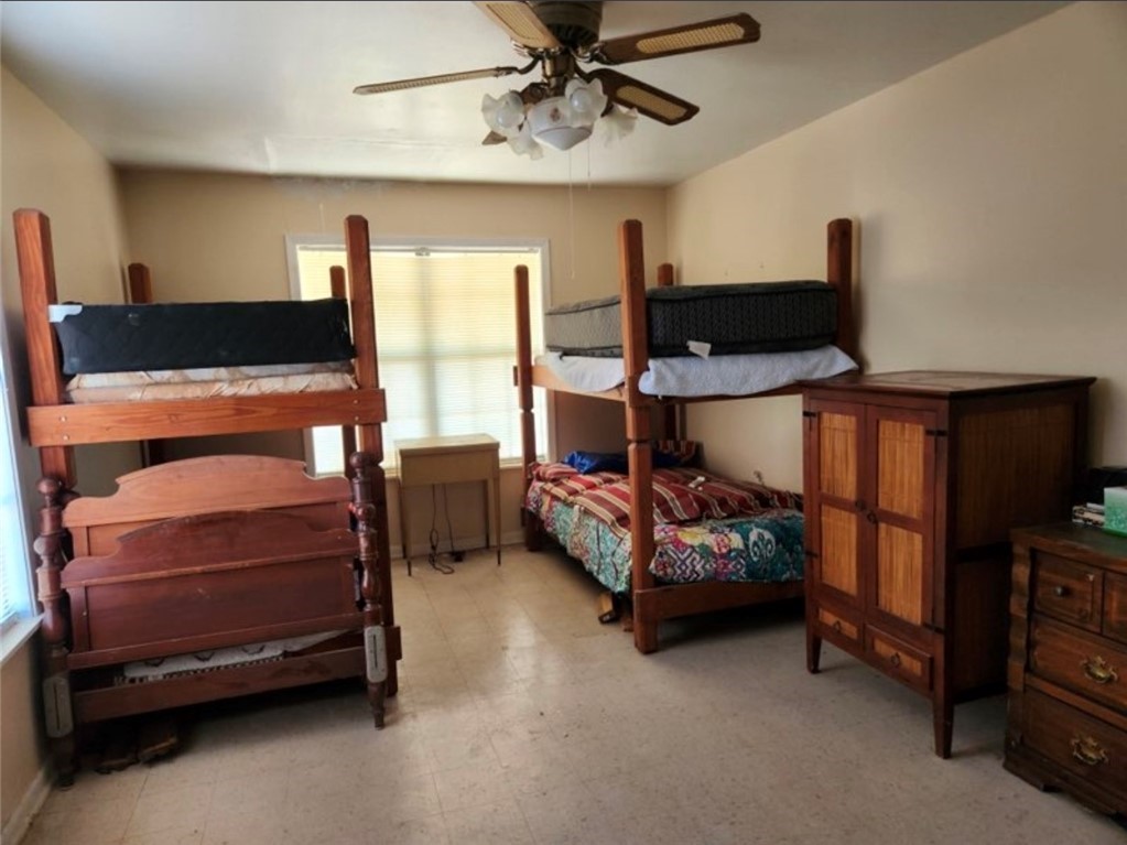 49 Bayview Drive Mathis, TX 78368 - Photo 9 of 20 a bedroom with furniture and a flat tv screen