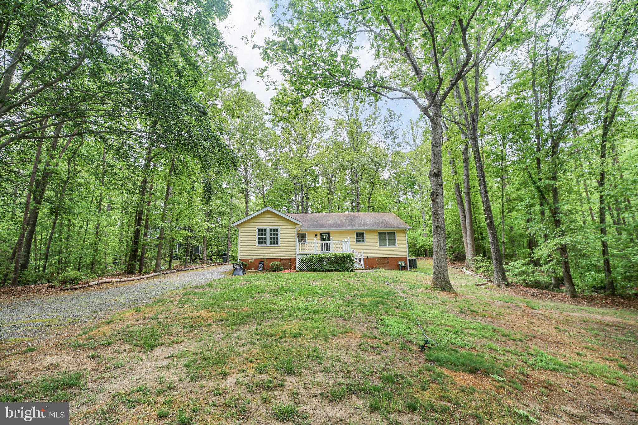 143 Cranes Corner Road Fredericksburg, VA 22405 - Photo 17 of 26 Charming home nestled in lush greenery.
