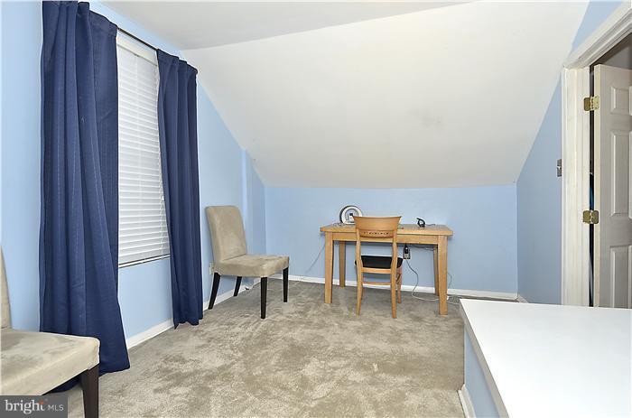 310 West Glebe Road Alexandria, VA 22305 - Photo 13 of 22 a view of a livingroom with furniture and a window
