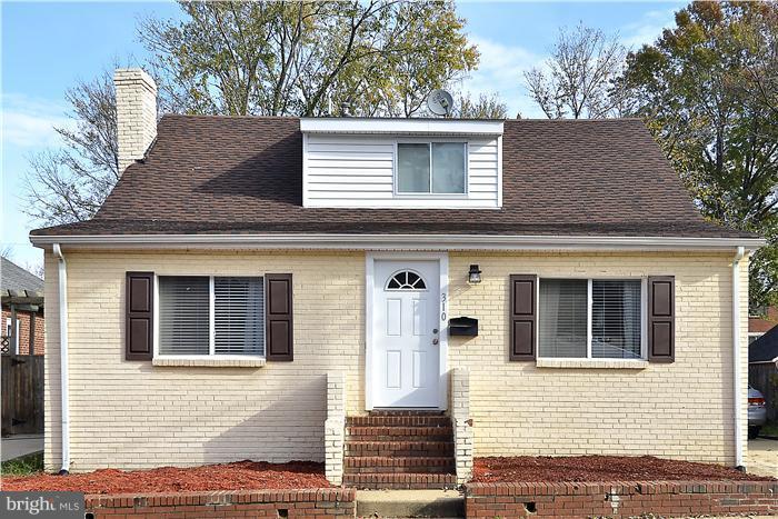 310 West Glebe Road Alexandria, VA 22305 - Photo 22 of 22 a view of a house with a door and a tree