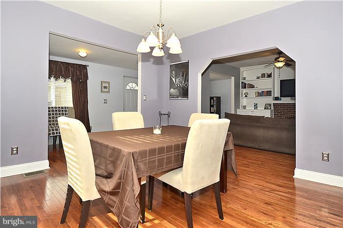 310 West Glebe Road Alexandria, VA 22305 - Photo 4 of 22 a view of a dining room with furniture and wooden floor