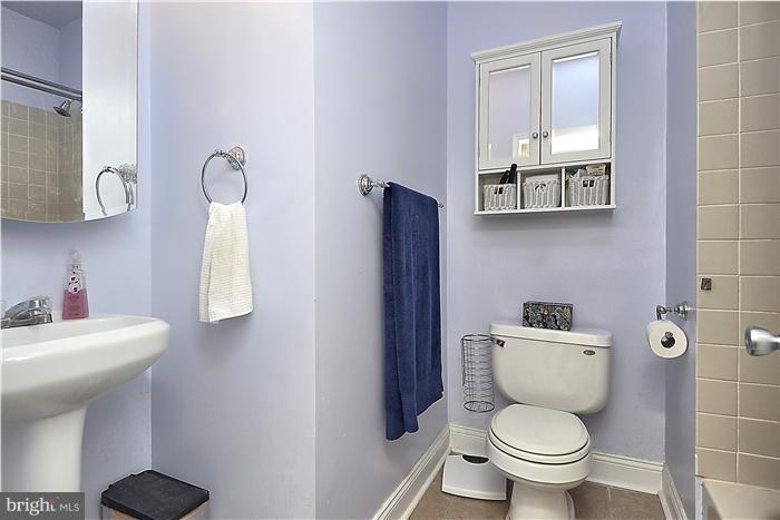 310 West Glebe Road Alexandria, VA 22305 - Photo 6 of 22 a bathroom with a toilet sink and mirror