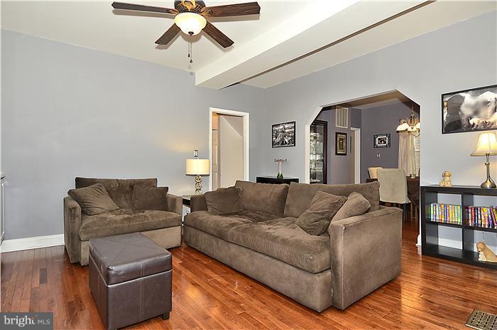 310 West Glebe Road Alexandria, VA 22305 - Photo 8 of 22 a living room with furniture and a wooden floor