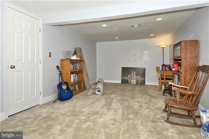 310 West Glebe Road Alexandria, VA 22305 - Photo 10 of 22 a room with furniture and a fireplace