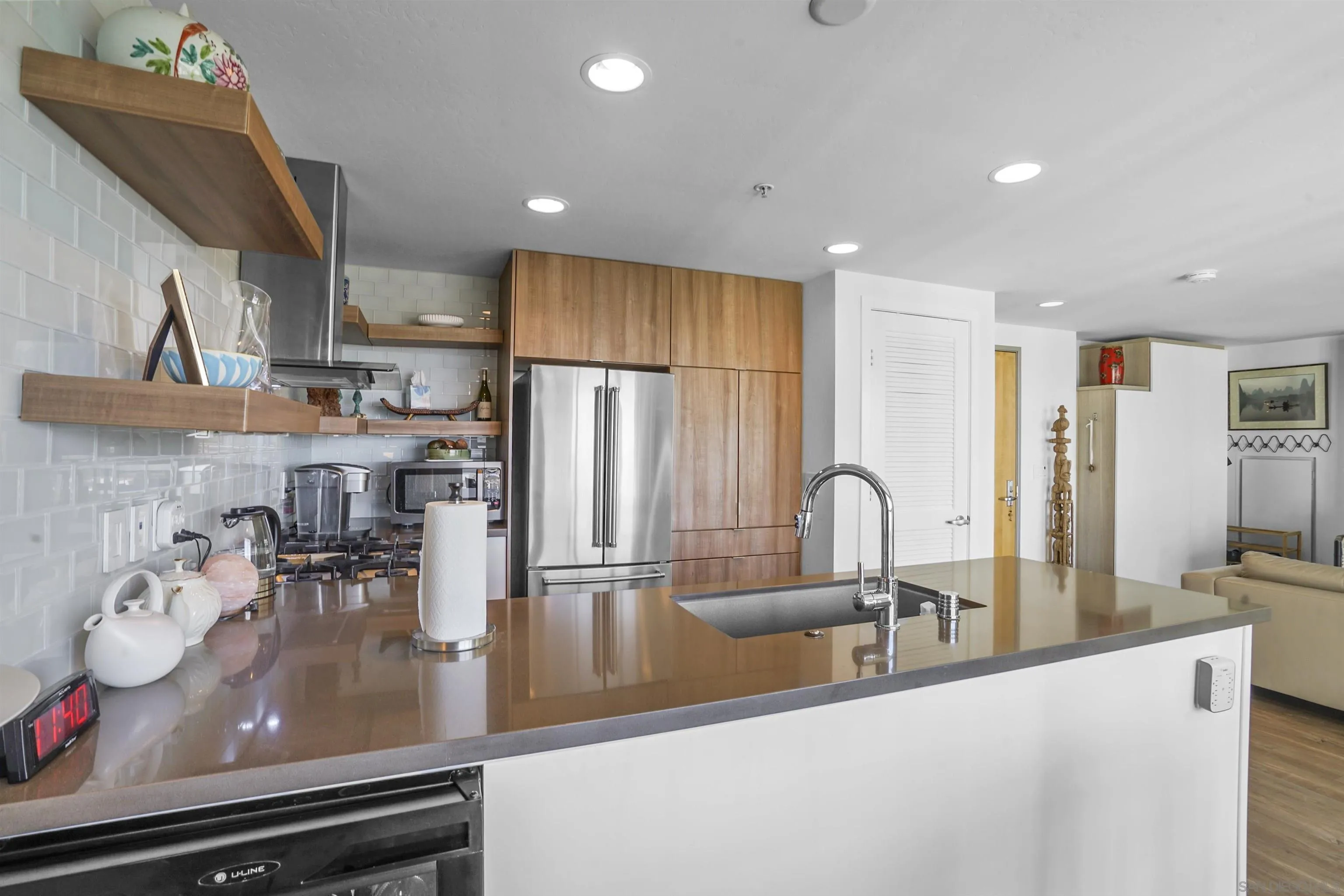 3812 Park Boulevard, Unit 503 San Diego, CA 92103 - Photo 11 of 27 a kitchen with stainless steel appliances granite countertop a sink a stove and refrigerator