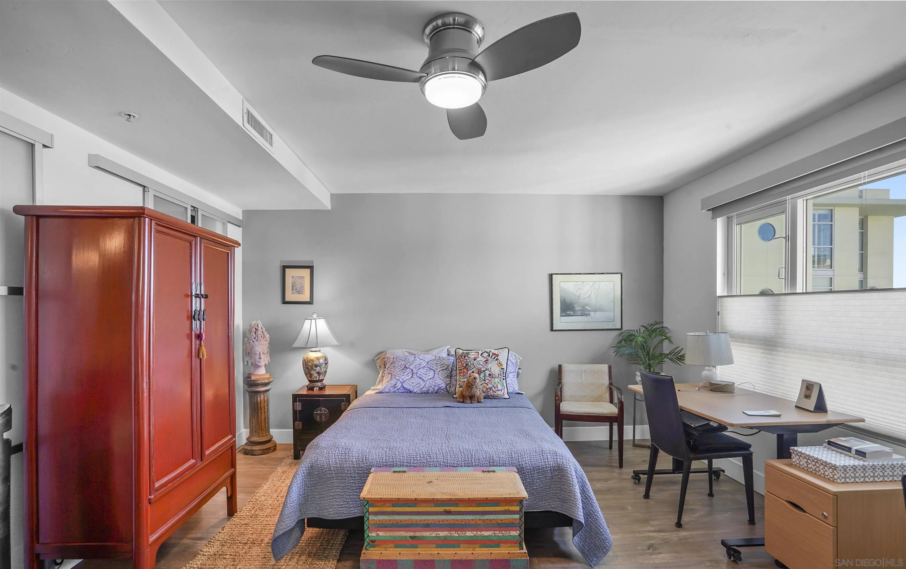 3812 Park Boulevard, Unit 503 San Diego, CA 92103 - Photo 13 of 27 a bedroom with a bed and a chandelier