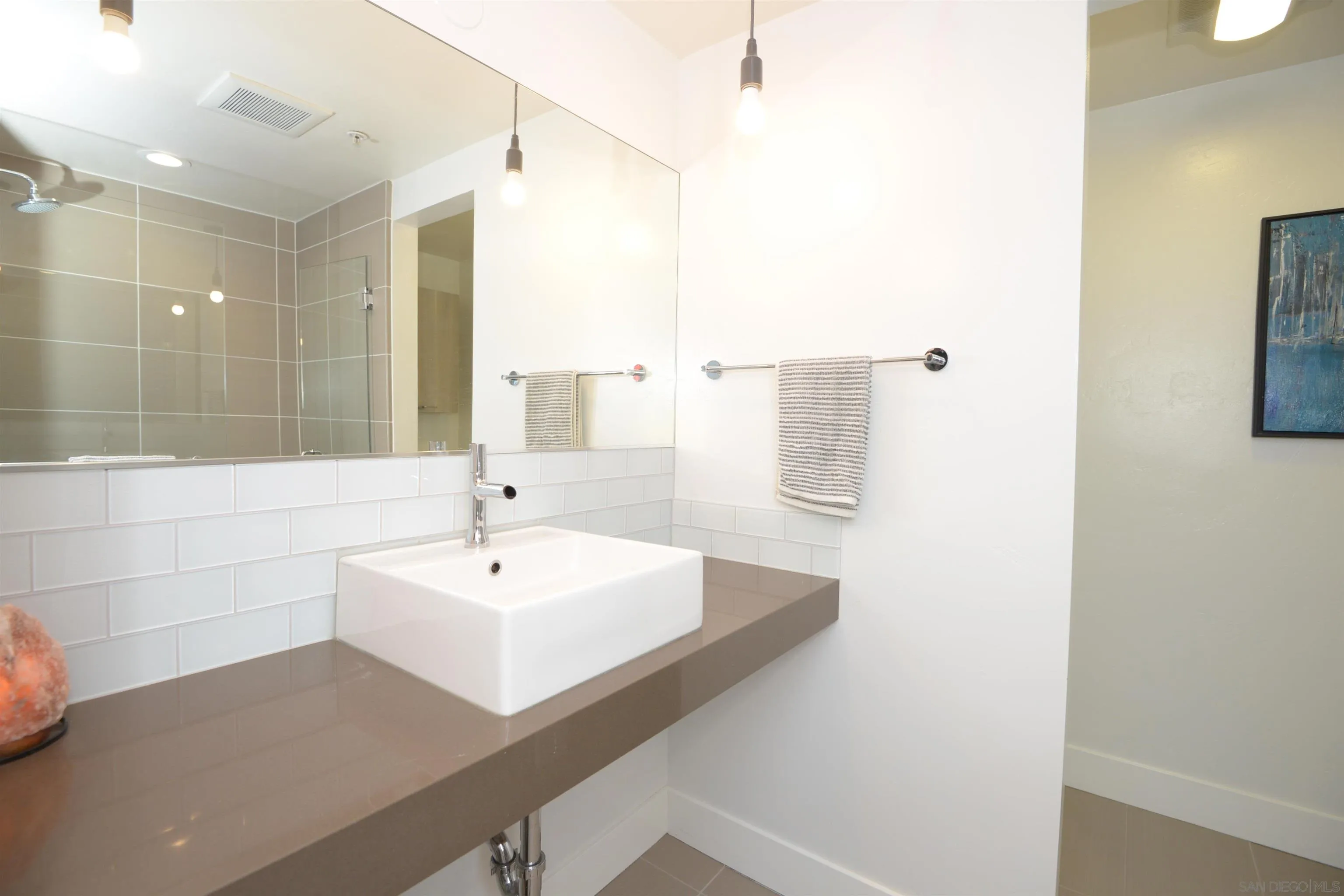 3812 Park Boulevard, Unit 503 San Diego, CA 92103 - Photo 16 of 27 a bathroom with a sink and a mirror