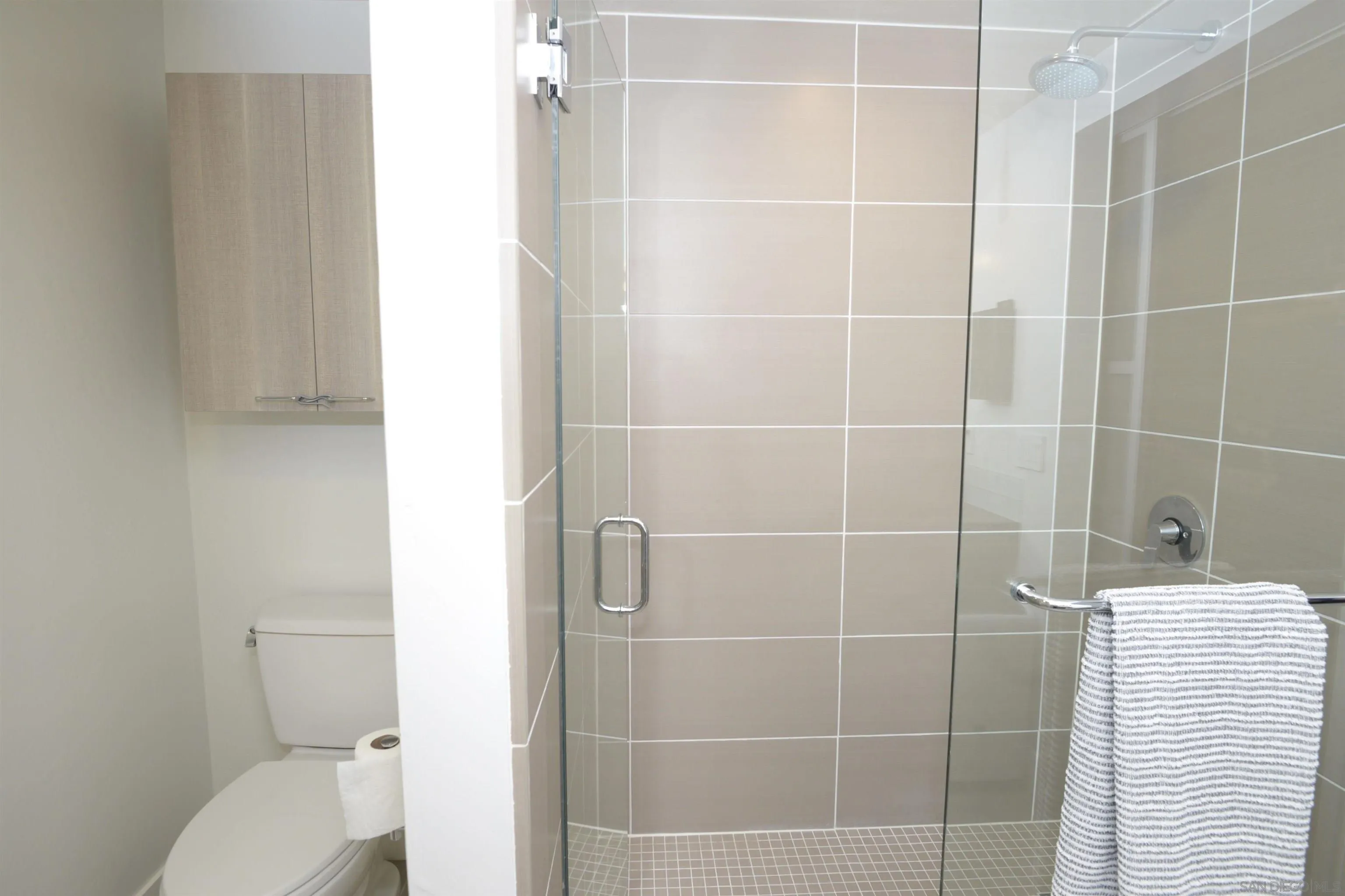 3812 Park Boulevard, Unit 503 San Diego, CA 92103 - Photo 17 of 27 a bathroom with a toilet and a shower