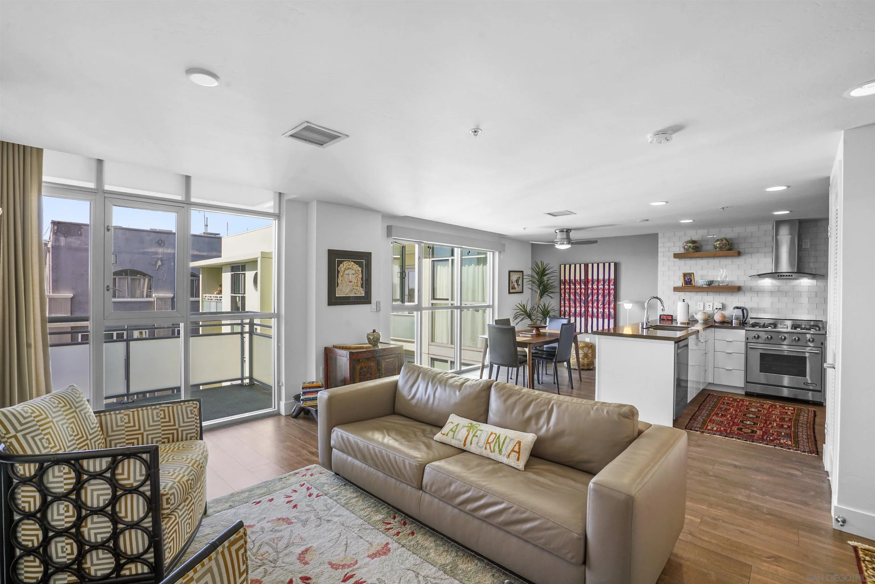 3812 Park Boulevard, Unit 503 San Diego, CA 92103 - Photo 2 of 27 a living room with furniture and a wooden floor