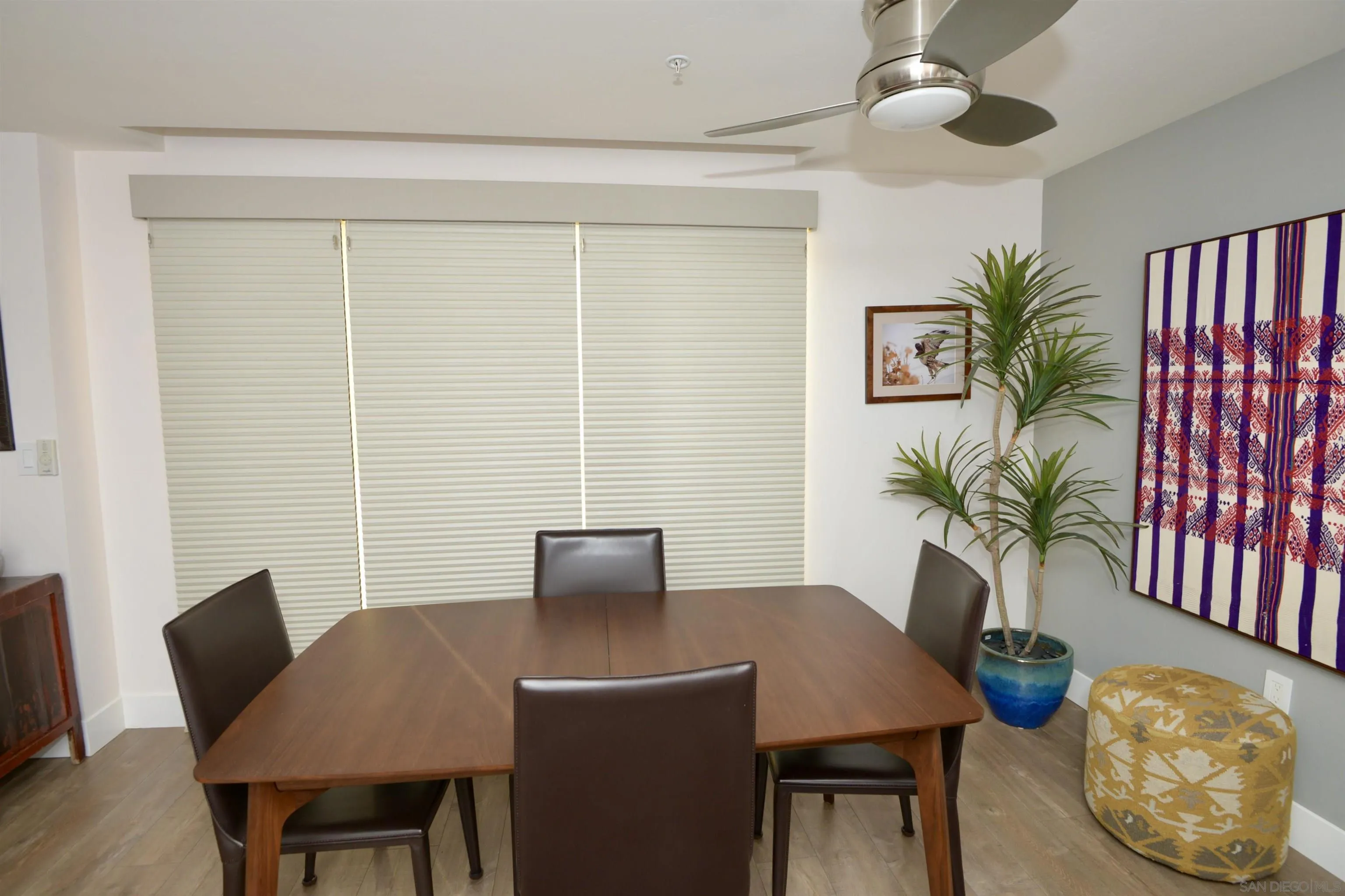 3812 Park Boulevard, Unit 503 San Diego, CA 92103 - Photo 22 of 27 a view of a dining room with furniture and wooden floor