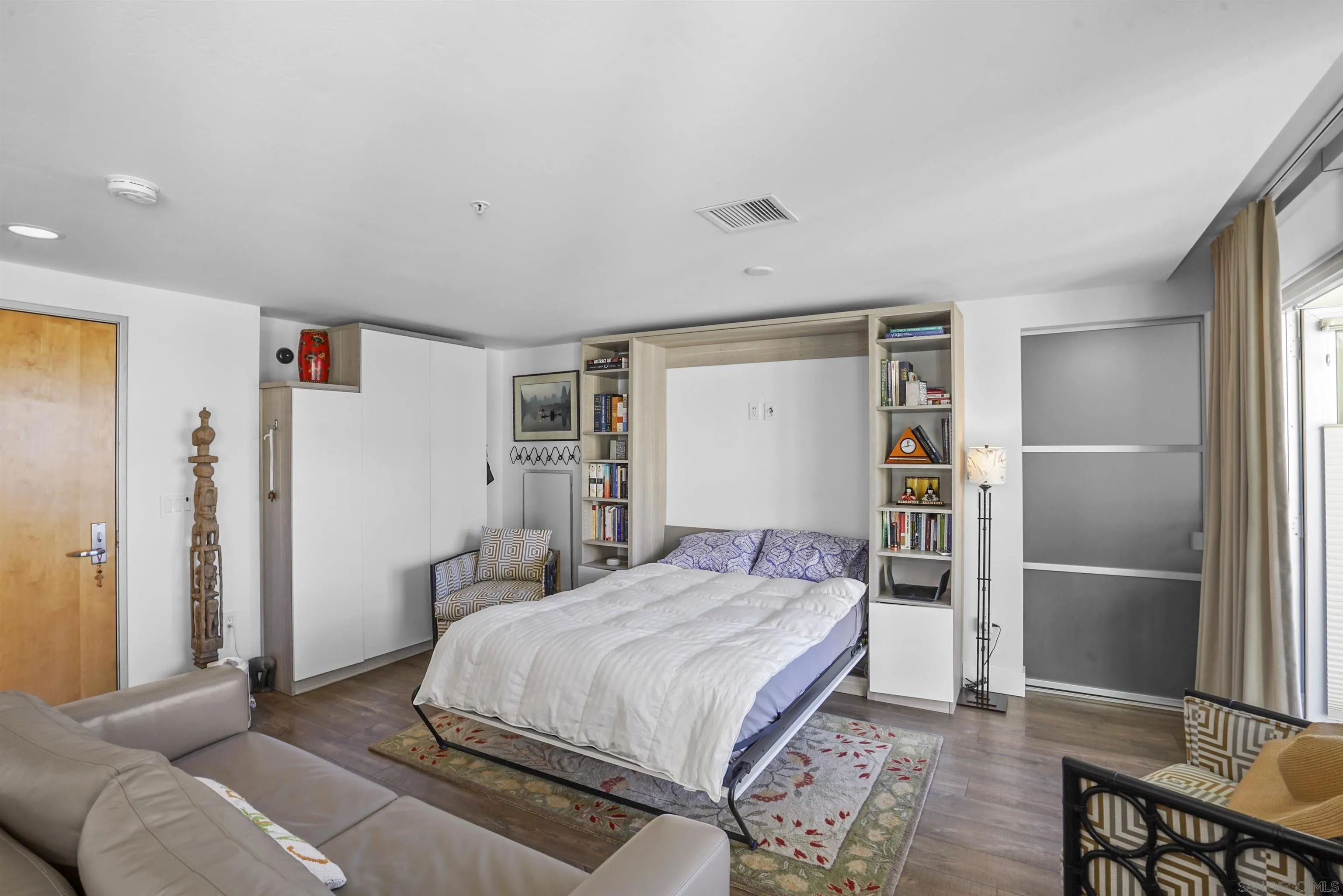 3812 Park Boulevard, Unit 503 San Diego, CA 92103 - Photo 6 of 27 a bedroom with a bed and a refrigerator