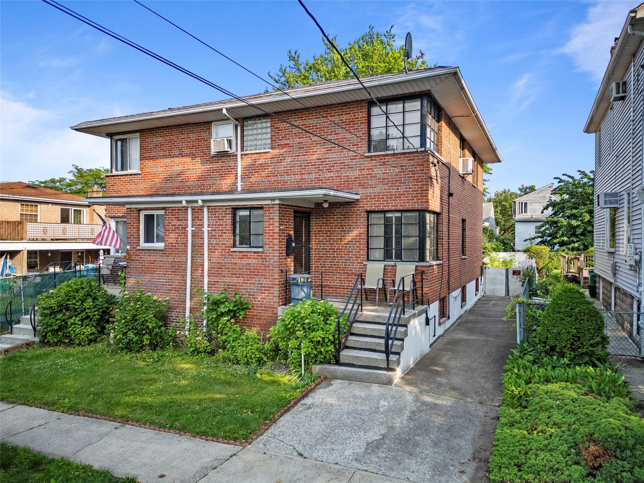 View of front of property featuring brick siding