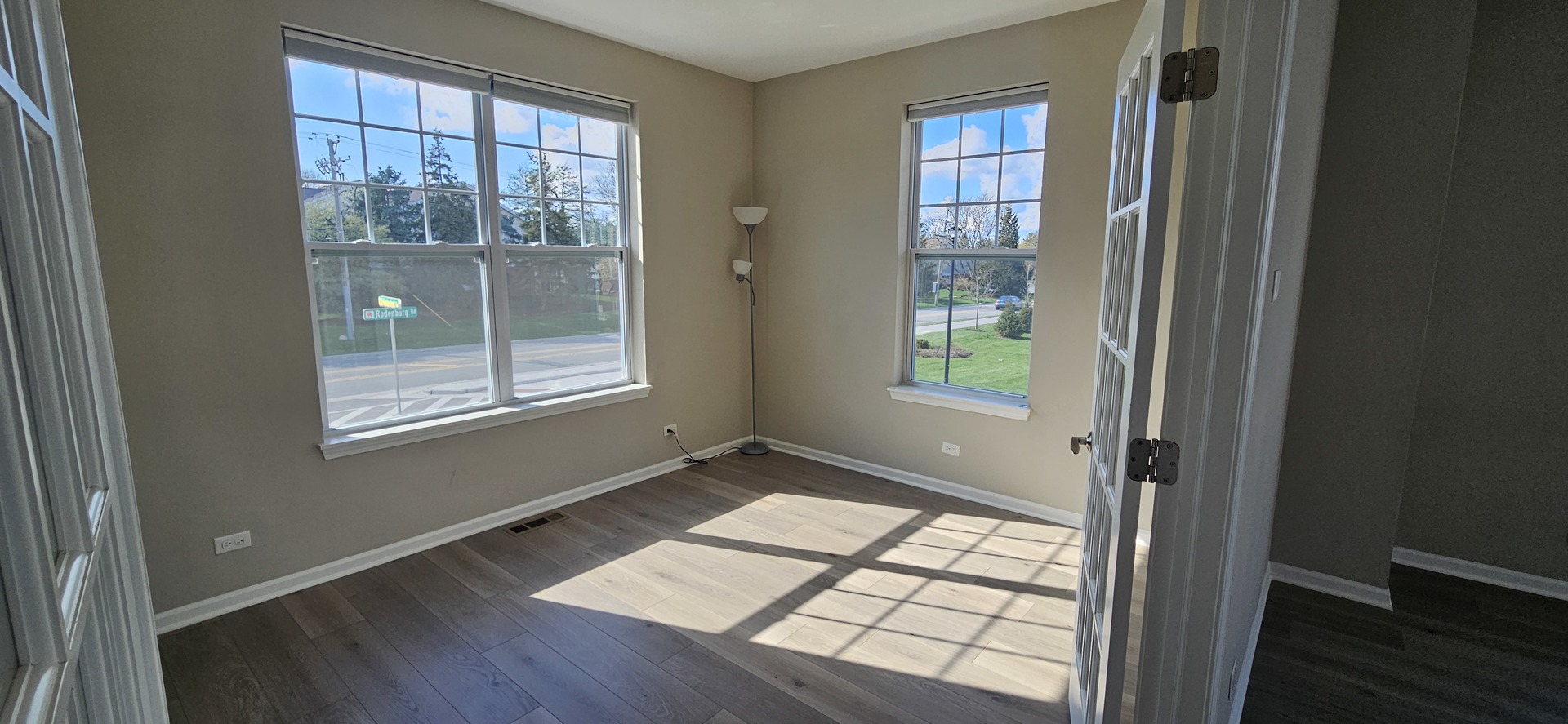 210 Timberleaf Circle Roselle, IL 60172 - Photo 5 of 14 an empty room with wooden floor and windows