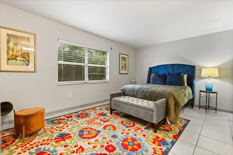 a bedroom with a bed and window