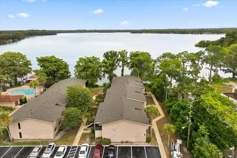 an aerial view of a house with a lake view