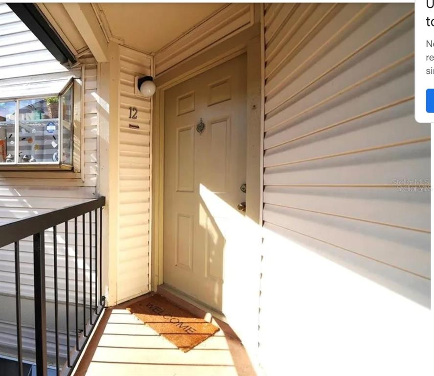 a view of a balcony with door