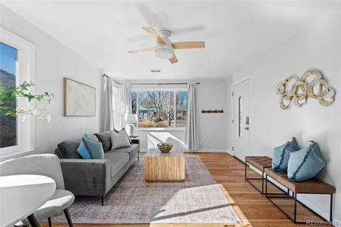 a living room with furniture and a rug