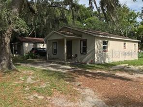 1603-1605 Rose Lane Eustis, FL 32726 - Photo 2 of 14 a view of a house with a yard