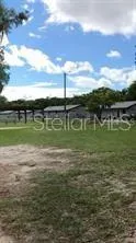 a view of a lake with a big yard