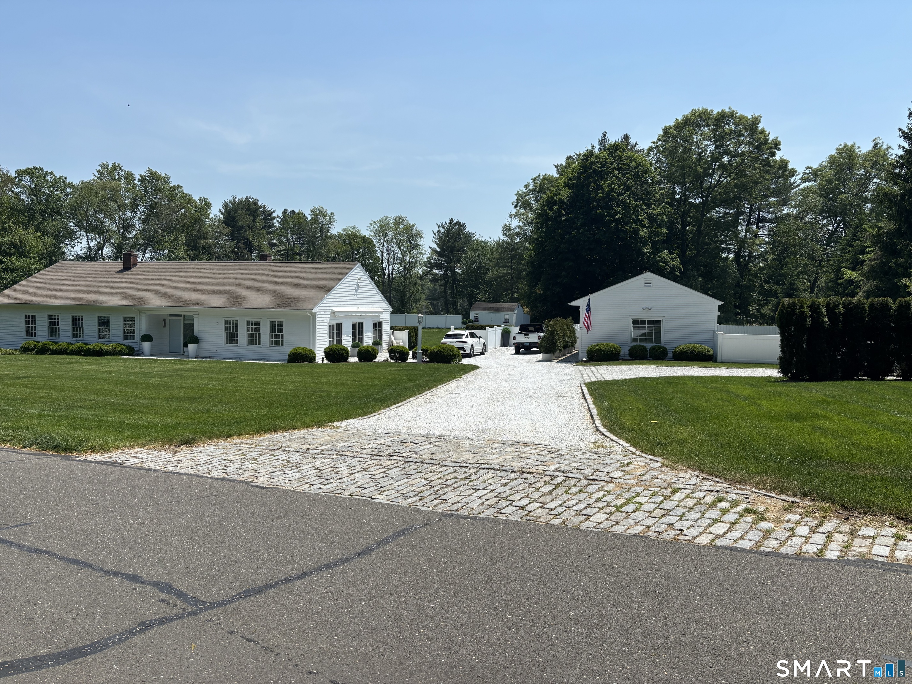 4 A Stoneboat Road Westport, CT 06880 - Photo 1 of 24 a view of house with garden and tall trees