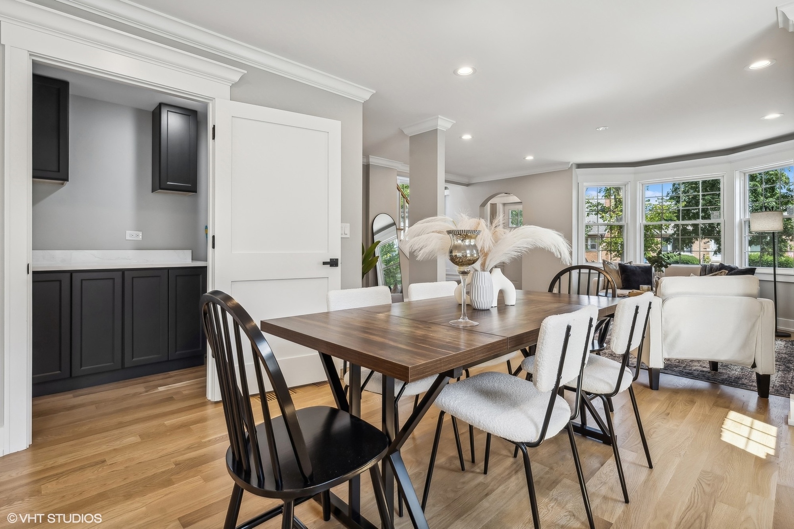 Undisclosed Address Elmhurst, IL 60126 - Photo 13 of 53 a view of a dining room with furniture and wooden floor