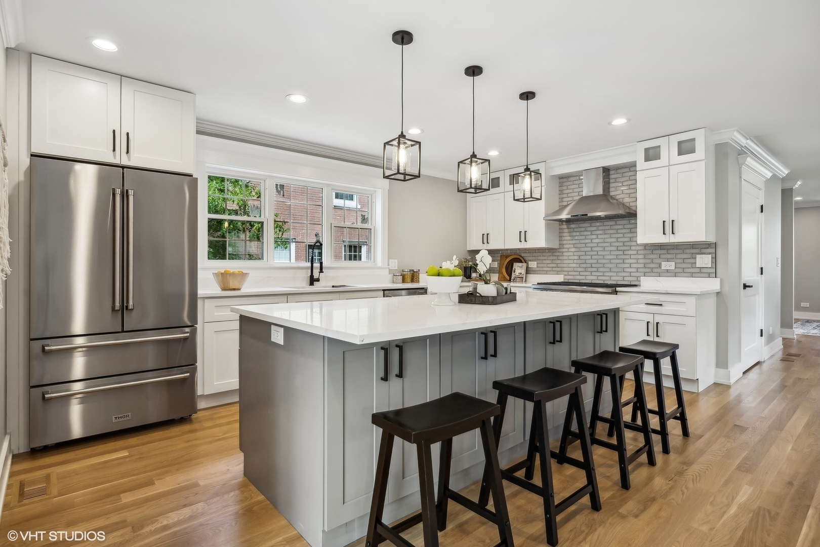 Undisclosed Address Elmhurst, IL 60126 - Photo 16 of 53 a kitchen with kitchen island granite countertop a sink a center island stainless steel appliances and cabinets
