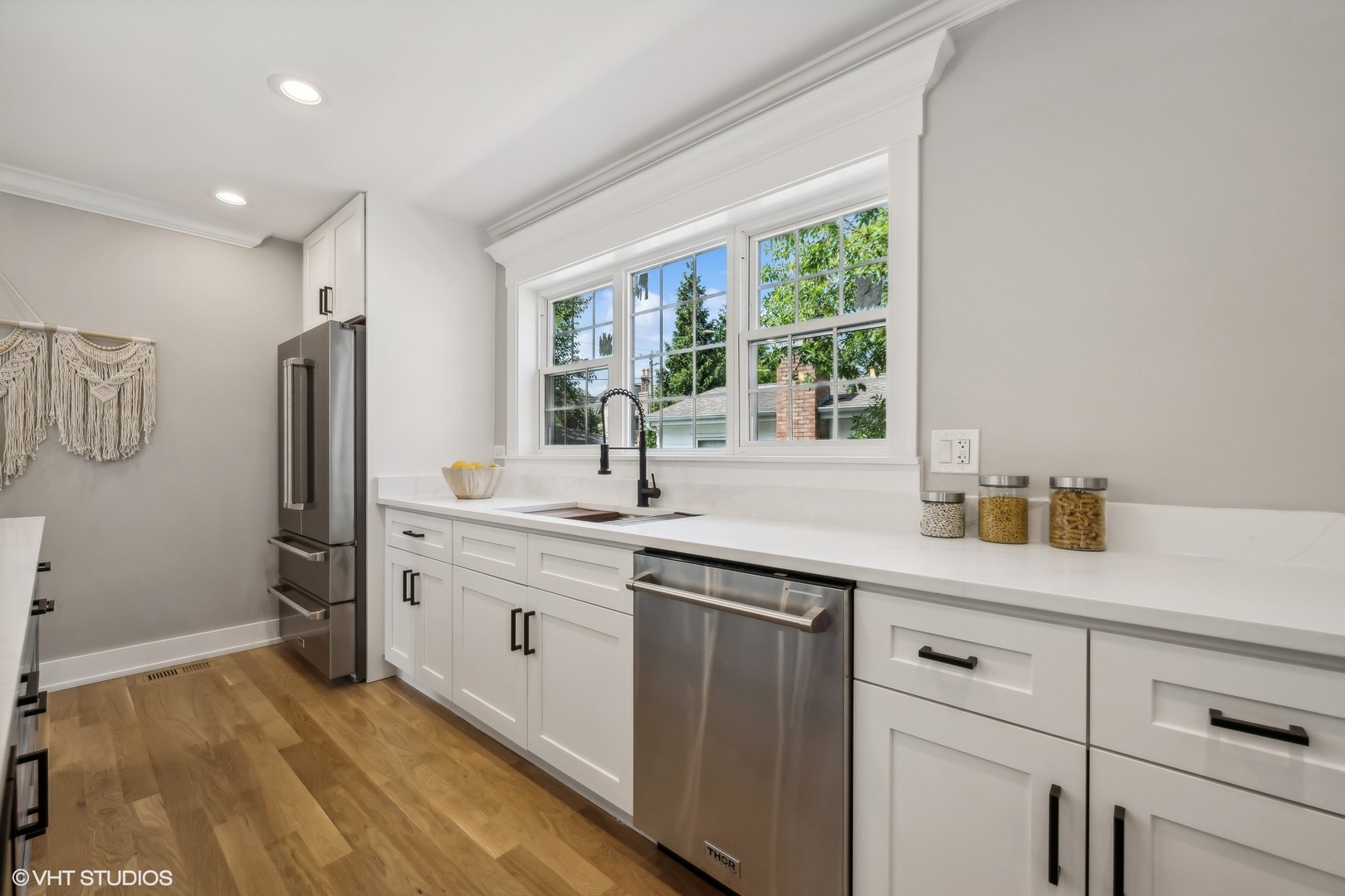Undisclosed Address Elmhurst, IL 60126 - Photo 21 of 53 a kitchen with stainless steel appliances granite countertop a sink and a refrigerator