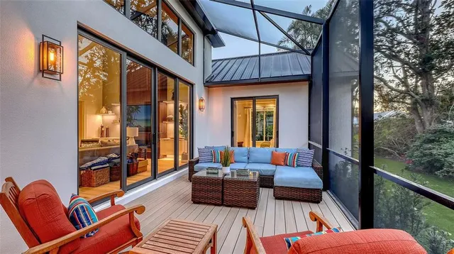 a large kitchen with kitchen island a island a sink and a stove in it