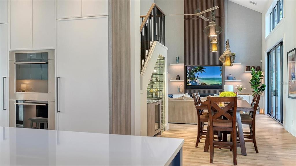 5035 Bay Shore Road Sarasota, FL 34234 - Photo 23 of 84 a view of a dining room with furniture and wooden floor