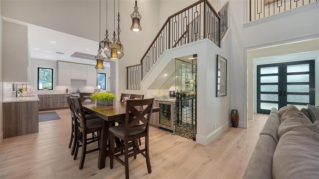 5035 Bay Shore Road Sarasota, FL 34234 - Photo 25 of 84 a view of a dining room with furniture and a chandelier
