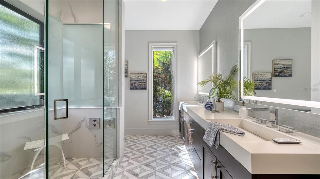 5035 Bay Shore Road Sarasota, FL 34234 - Photo 30 of 84 a spacious bathroom with a sink and a mirror