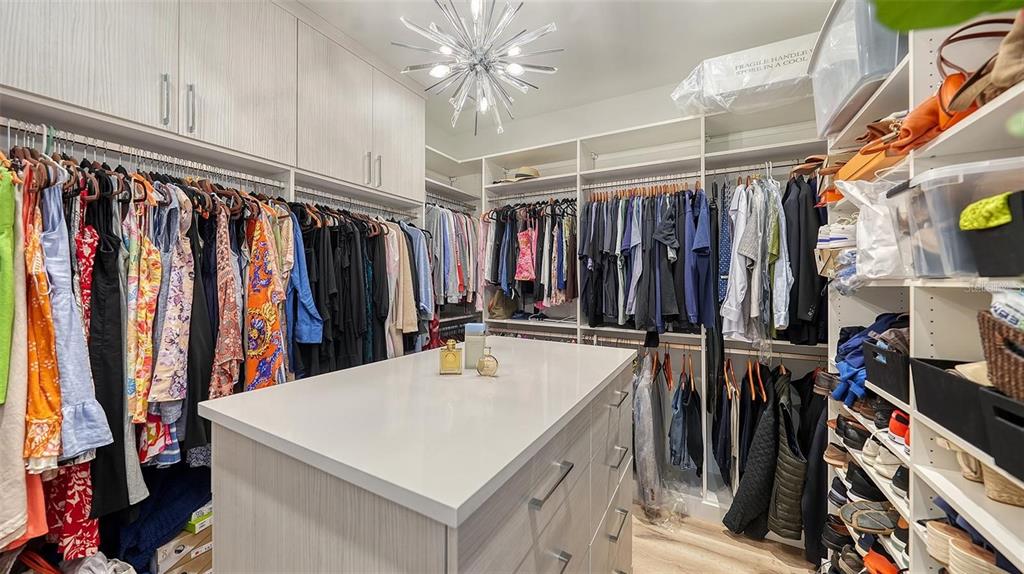 5035 Bay Shore Road Sarasota, FL 34234 - Photo 33 of 84 a view of walk in closet with clothes