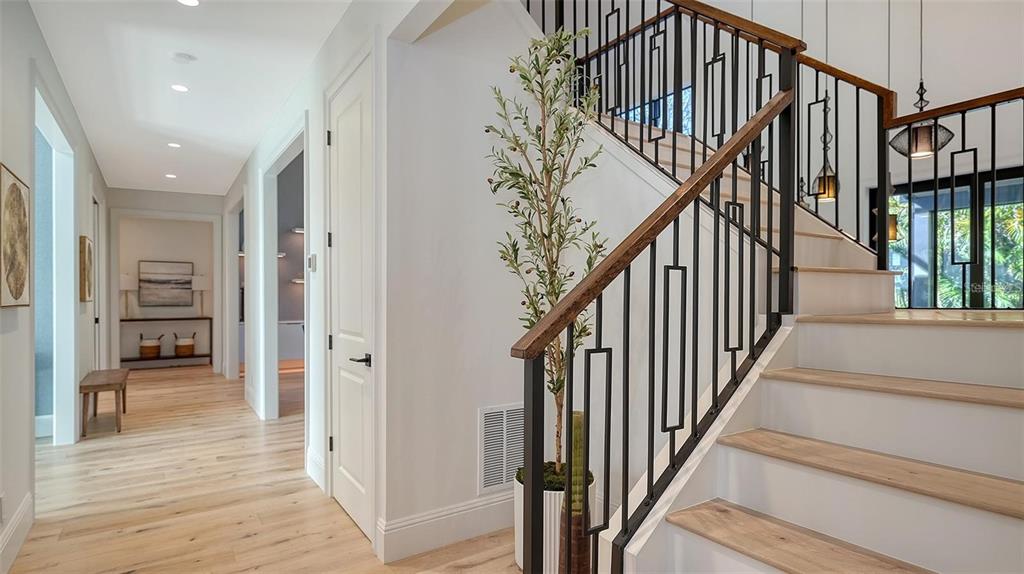 5035 Bay Shore Road Sarasota, FL 34234 - Photo 35 of 84 a view of entryway and hall with wooden floor