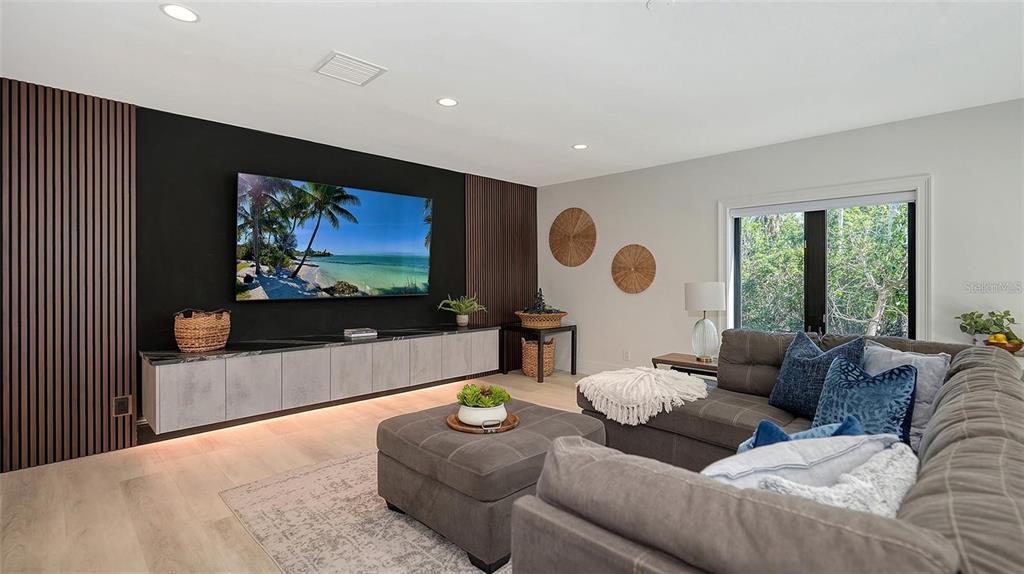 5035 Bay Shore Road Sarasota, FL 34234 - Photo 38 of 84 a living room with furniture and a flat screen tv