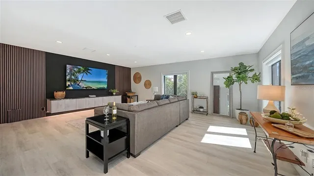 a bedroom with a bed lamp and a window
