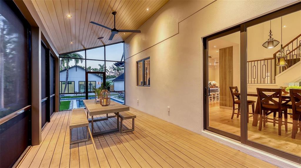 5035 Bay Shore Road Sarasota, FL 34234 - Photo 45 of 84 a outdoor space with lots of furniture and wooden floor