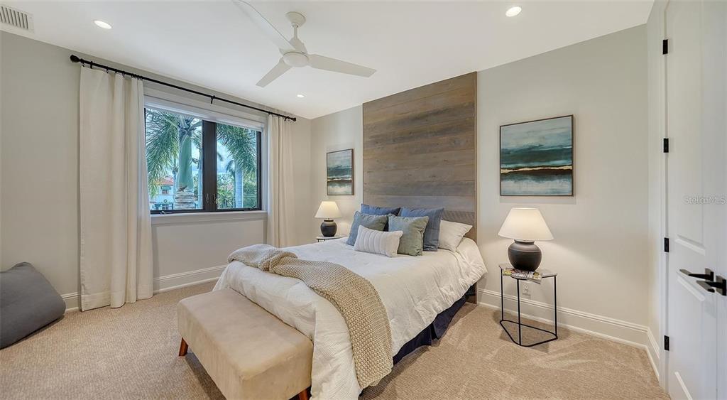5035 Bay Shore Road Sarasota, FL 34234 - Photo 54 of 84 a bedroom with a bed lamp and a window