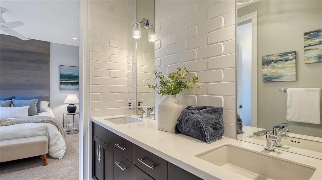 5035 Bay Shore Road Sarasota, FL 34234 - Photo 55 of 84 a bathroom with a double vanity sink and a mirror